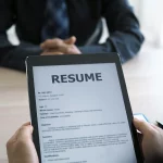 hiring-manager-looks-at-the-job-applicant-s-resume